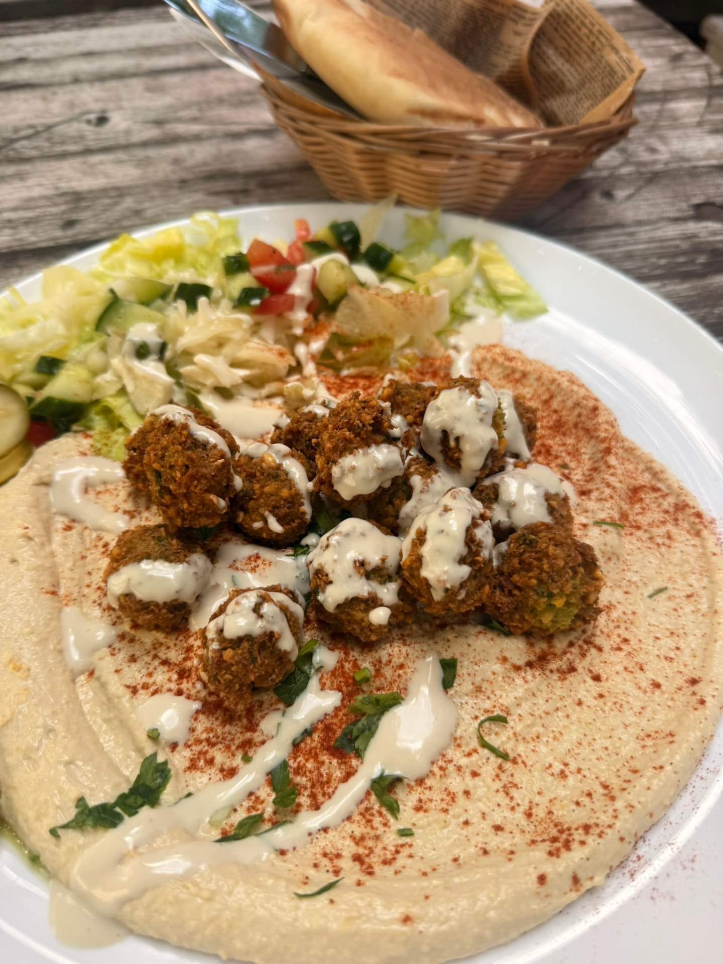 Sababa Teller with hummus, falafel, salad and fresh pita